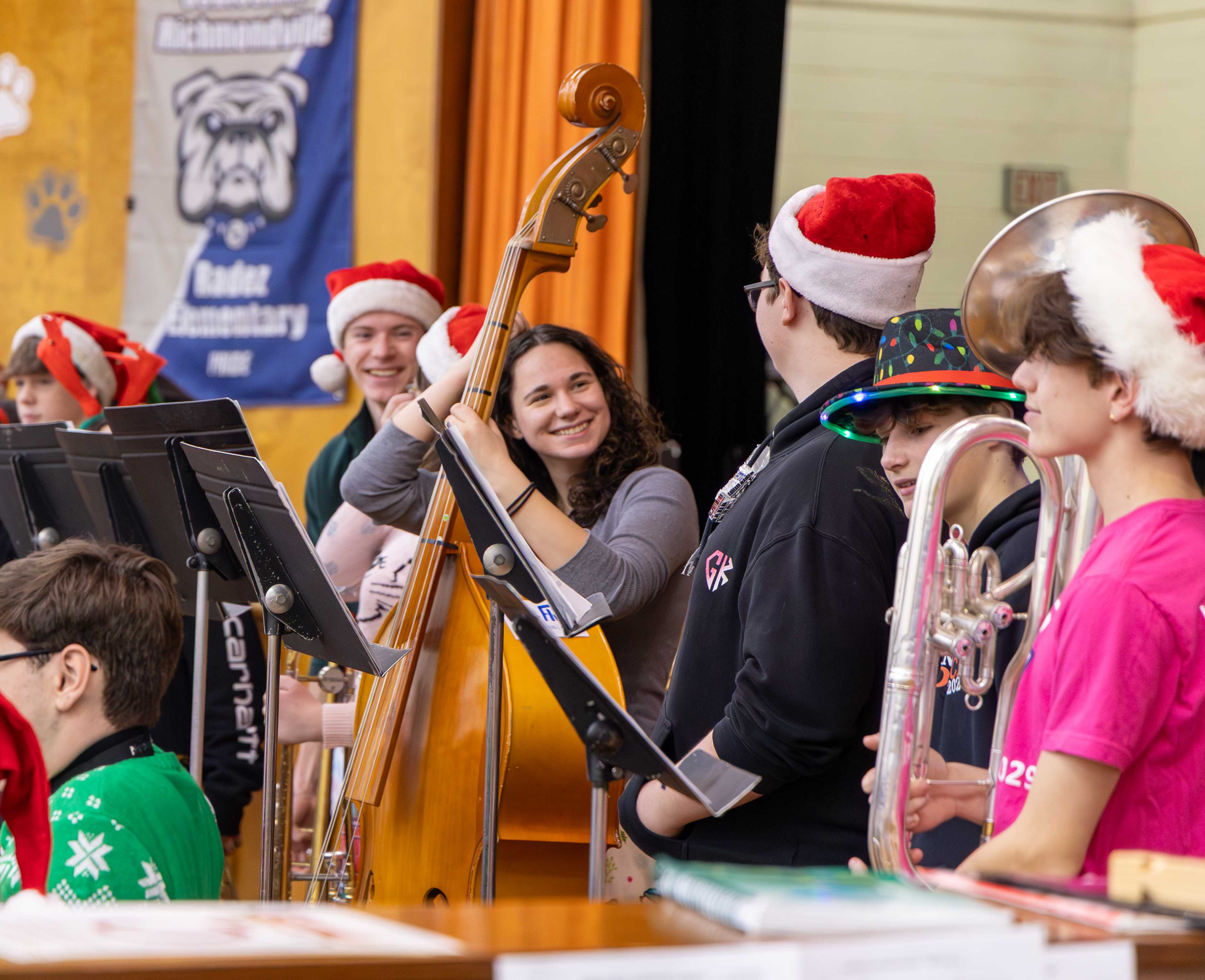 Students in the band smile between songs